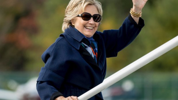 Democratic presidential candidate Hillary Clinton waves as she boards her campaign plane in New York on Saturday. 
