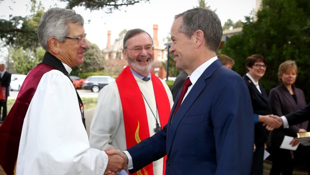 Opposition Leader Bill Shorten is welcomed to the Ecumenical Service to mark the opening of the 45th Parliament at the Church of St Andrew in Canberra. The same-sex marriage confrontation occurred after the ceremony.