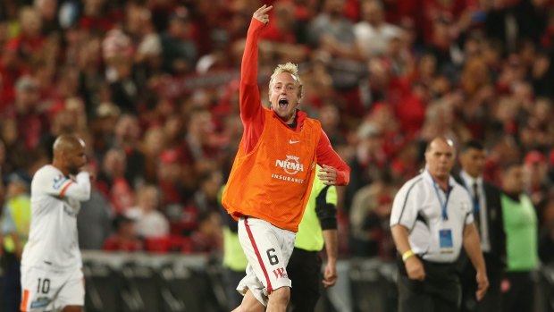Two fingered salute: Mitch Nichols has been fined for his post-match celebrations after the Wanderers last gasp victory over the Brisbane Roar in the A-League semi finals.