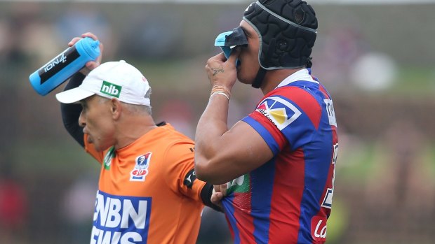 Series of head knocks: Sione Mata'utia is escorted from the field in round three after clashing heads with South Sydney's Robbie Rochow. 