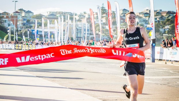 Harry Summers, the first man to cross the finish line at the 2016 City2Surf at Bondi Beach.