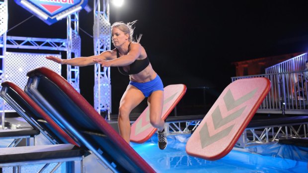 Zoe Featonby attempts the quintuple steps on the Australian Ninja Warrior course.