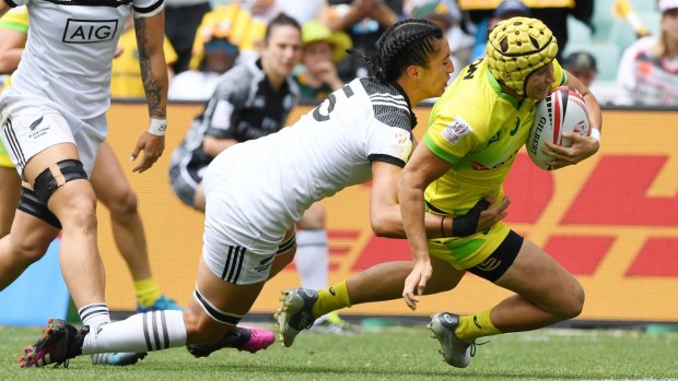 Straight through: New Zealand can't stop Shannon Parry scoring in the Sydney Sevens final.