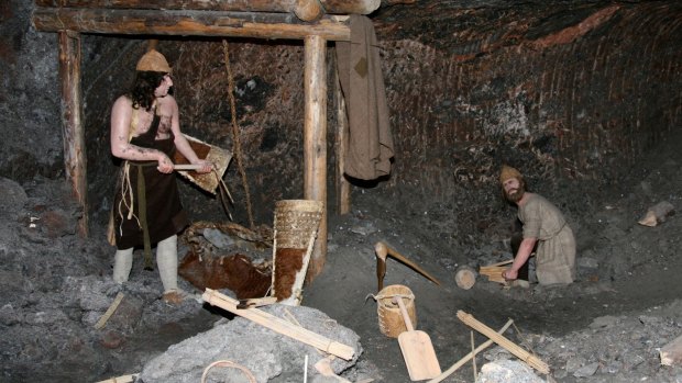 A display of primitive miners working in a salt mine.