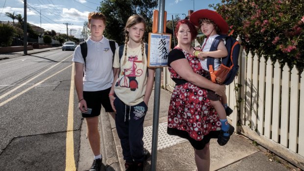 Single mother Allyson Griffith, who is calling for free public transport for schoolchildren, with her kids Charlie Gray, 14, Lucinda Gray, 12, and Felix Carrillo, 4, in Preston on Sunday.