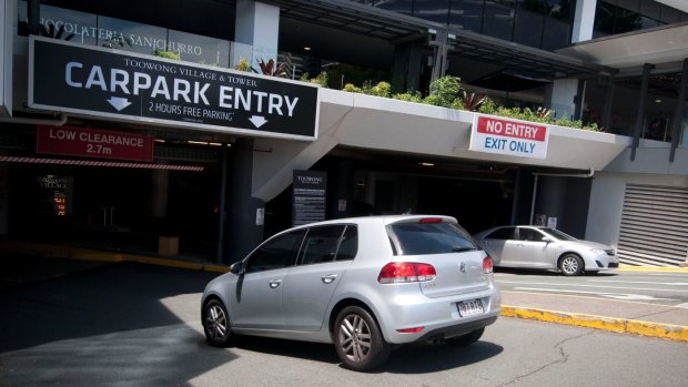 Commuters, university students and the surrounding business district are to blame for Toowong Village finally giving in to paid parking.