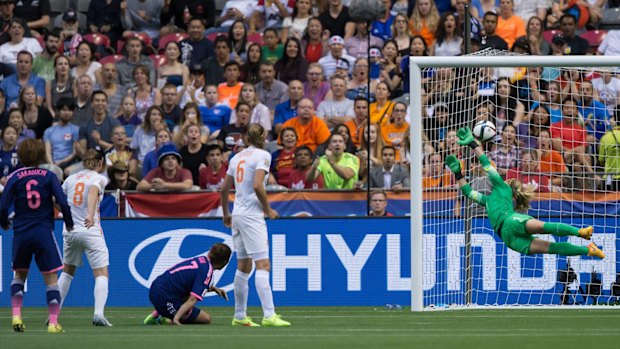 Japan's Mizuho Sakaguchi,left, scores during the second half.