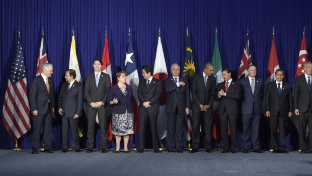 NZ Prime Minsiter John Key, fourth from right, and other leaders of the Trans-Pacific Partnership countries (in suits), in Manila, Philippines, on Wednesday.