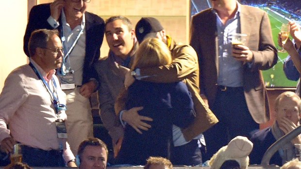 A warm embrace: Kylie Minogue and Joshua Sasse at the Rugby World Cup on Saturday.