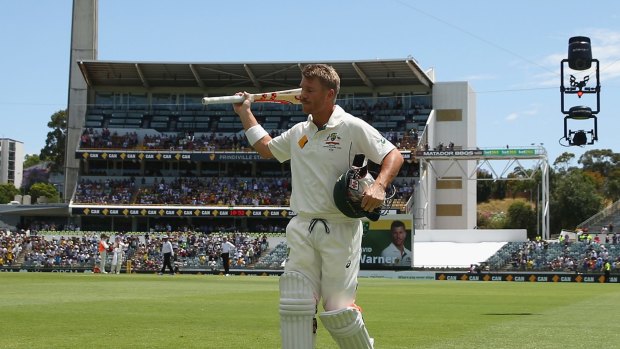 Double ton: David Warner acknowledges the crowd.