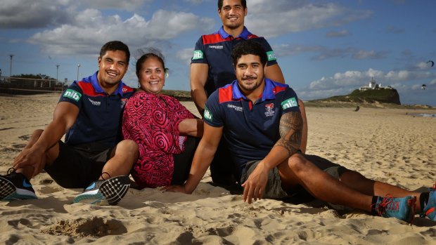 Happy family: Mrs Mata’utia with her sons Pat, Sione and Chanel at Nobbys Beach.