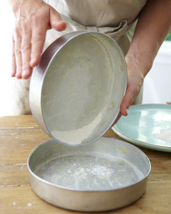 Lining or dusting your pan with flour will prevent your cake from sticking.
