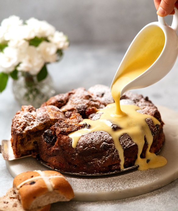 Serve this hot cross bun bread and butter pudding cake with custard.
