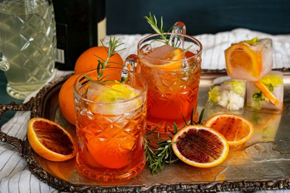 Aperol spritzes with optional fruit-filled ice cubes. 