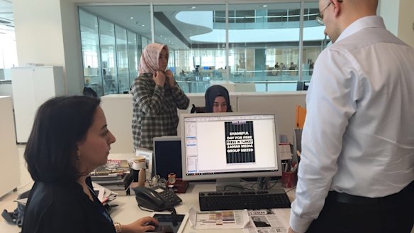 Editors at <i>Today's Zaman</i> newspaper in Turkey prepare for publication just before a police raid on the night of March 4. Editor-in-chief Sevgi Akarcesme is at left.