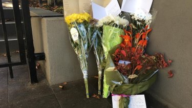 A floral tribute at the scene of the Brighton siege for Kai Hao.