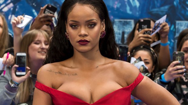 Rihanna, seen "bursting" out of her dress at the premiere of her new movie. 