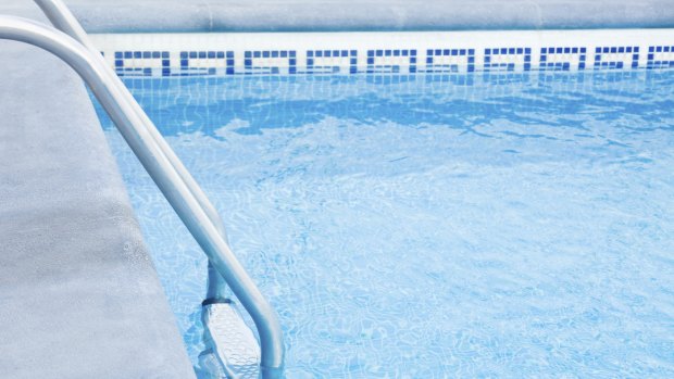 The death of a woman in a Gold Coast swimming pool is not being considered suspicious.