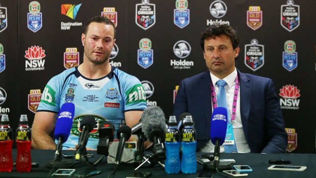 Shattered: Boyd Cordner and Laurie Daley face the music after the loss.