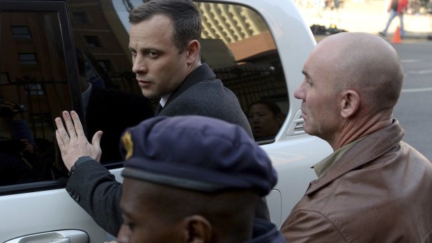 Oscar Pistorius arrives at the High Court in Pretoria, South Africa.