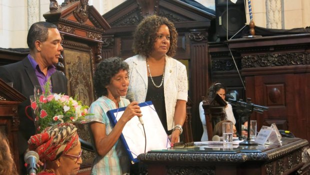 Maria da Penha Macena, centre, received an award from the Rio de Janeiro legislative assembly.
