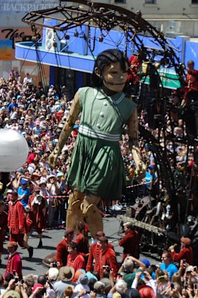 The Little Girl Giant draws crowds along Barrack Street.