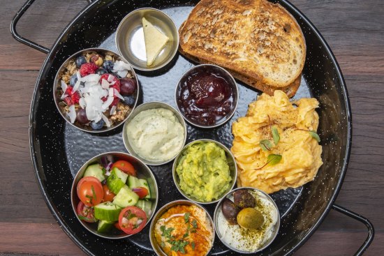 Israeli breakfast with scrambled eggs. 