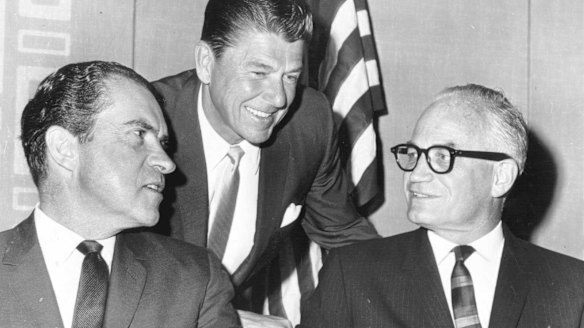 Ronald Reagan leans in to talk with Richard Nixon and Barry Goldwater (with glasses), the 1964 Republican presidential candidate.