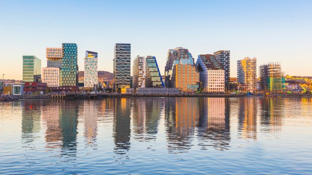 Modern buildings in Oslo, Norway, with their reflection into the water. These are some of the new buildings in the neighbourhood of Bjorvika.