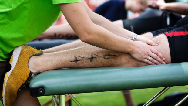 How much suffering is enough? Athletes in ultras are taped and massaged and medicated.