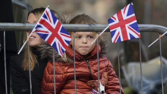 Members of the public line the streets in Ballater, Scotland, as the hearse carrying the coffin of Queen Elizabeth II, will pass through Ballater, as it continues its journey to Edinburgh from Balmoral.