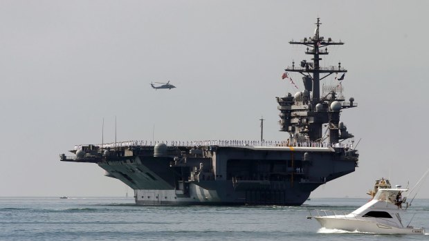 The aircraft carrier USS Carl Vinson sails out of San Diego Harbour.