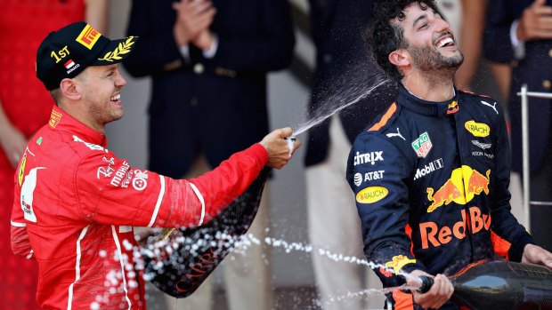 Ferrari's race winner Sebastian Vettel sprays Red Bull's Daniel Ricciardo, who finished third at the Monaco Grand Prix on Sunday.