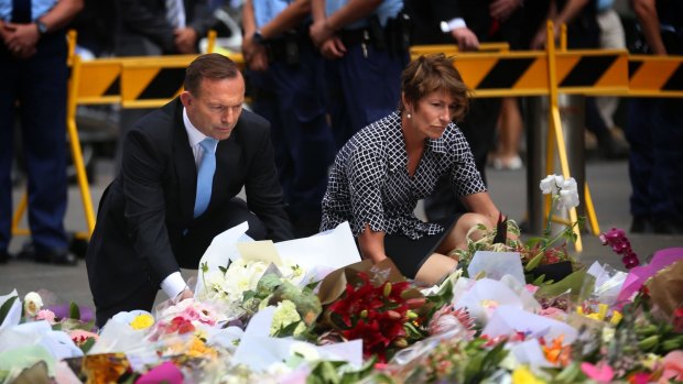 Prime Minister Tony Abbott and wife Margie left flowers at the makeshift memorial at Martin Place.