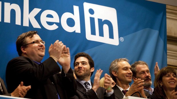 Reid Hoffman, chairman and co-founder of LinkedIn (left) and chief executive Jeff Weiner, (centre), applaud during the opening bell ceremony at the New York Stock Exchange as LinkedIn listed in 2011. 