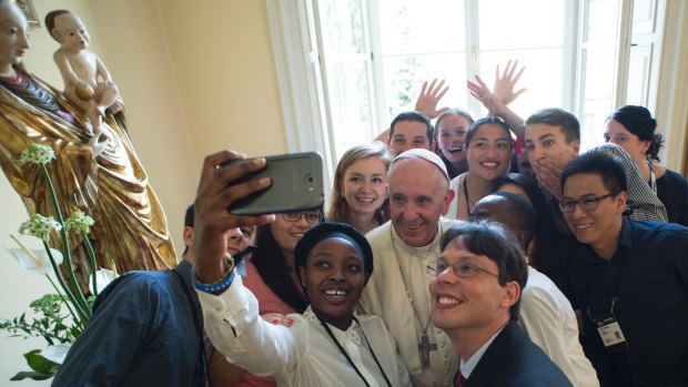 Pope Francis poses for a selfie after having lunch with young people at the Bishop's residence in Krakow, Poland, for World Youth Day last year.