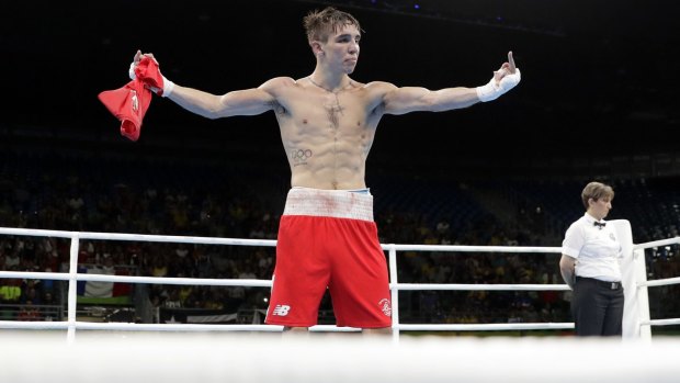 Angry protest: Ireland's Michael Conlan walks around with his shirt off after losing his fight.
