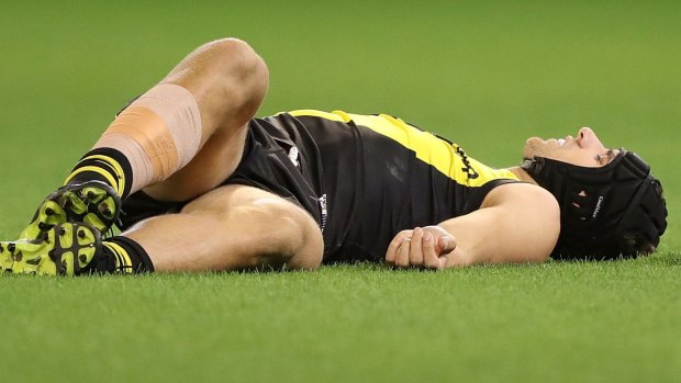 MELBOURNE, AUSTRALIA - MARCH 30: Ben Griffiths of the Tigers appears injured during the round two AFL match between the Richmond Tigers and the Collingwood Magpies at Melbourne Cricket Ground on March 30, 2017 in Melbourne, Australia. (Photo by Robert Cianflone/Getty Images)