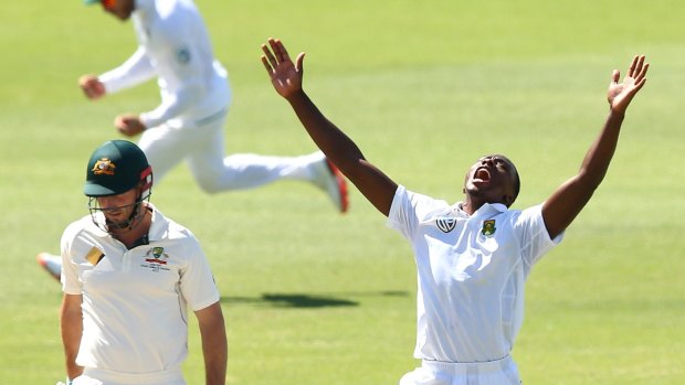 On your way: Kagiso Rabada celebrates the wicket of Shaun Marsh.