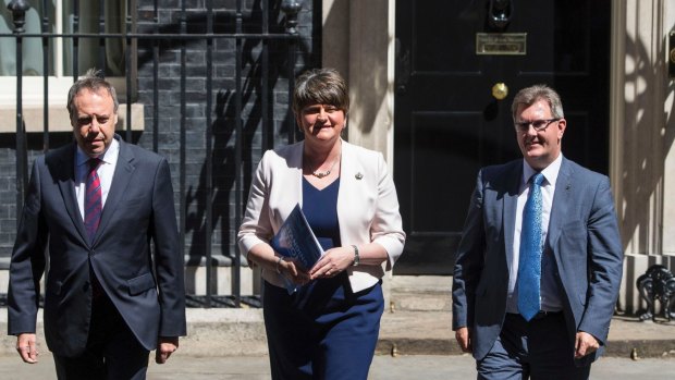 Democratic Unionist Party leaders outside 10 Downing Street after discussing a deal with the PM.