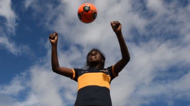 Investment in future: Shadeene Evans, 14, from Borroloola in the Northern Territory runs through some football drills at Westfield Sport High School. She was the first graduate of the John Moriarty Football program. 