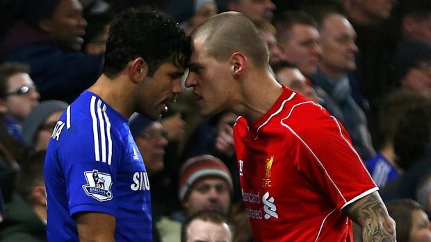 Head-to-head: Diego Costa and Martin Skrtel have words during the League Cup clash.