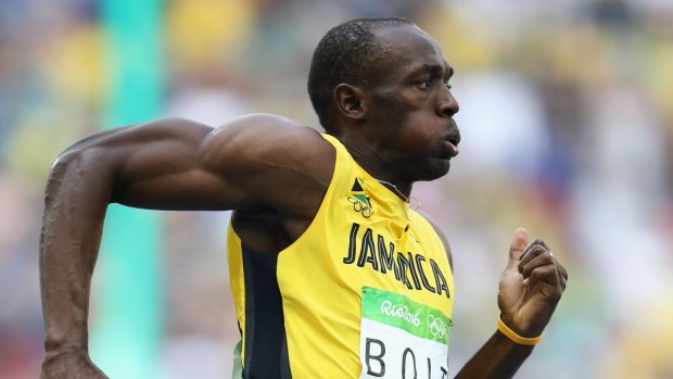 Cruising: Usain Bolt won his 200m heat with ease.