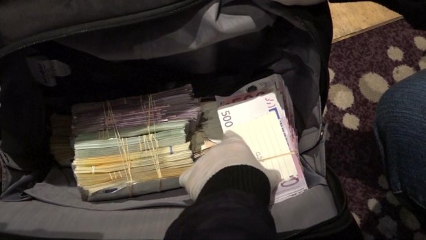 A large amount of cash was also seized in the arrests. 