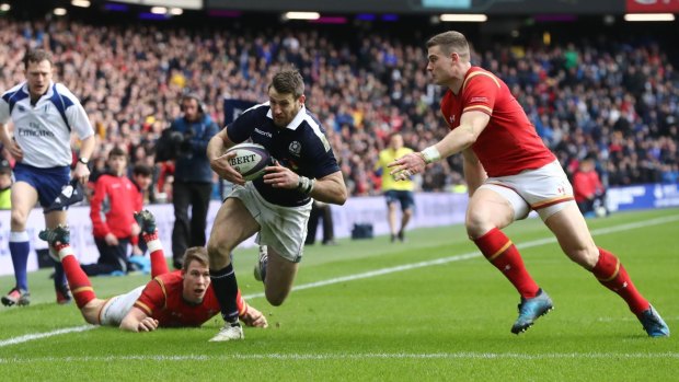Tommy Seymour beats the Welsh defence to score for Scotland at Murrayfield on Saturday.