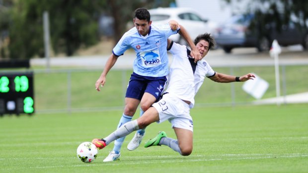 Sydney FC Youth player George Timotheou and FFA Centre of Excellence player Kosta Petratos in action.