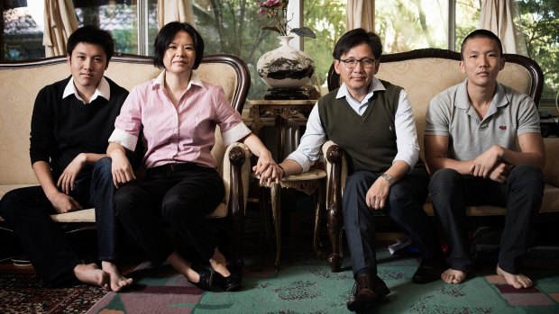 Vietnamese refugee Phong Nguyen (third from left), with his wife Karen and sons Damien and Vivald, is mourning the death of Malcolm Fraser.