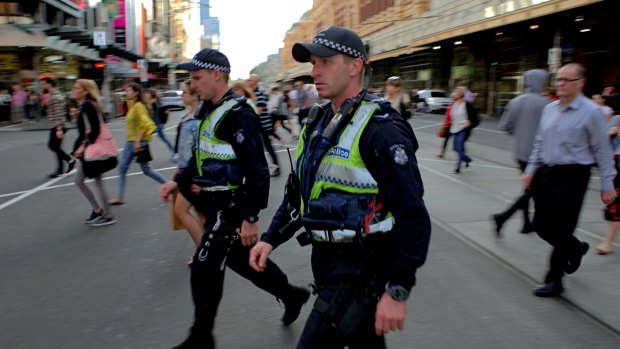 Police on the scene at Flinders Street on Friday morning. 