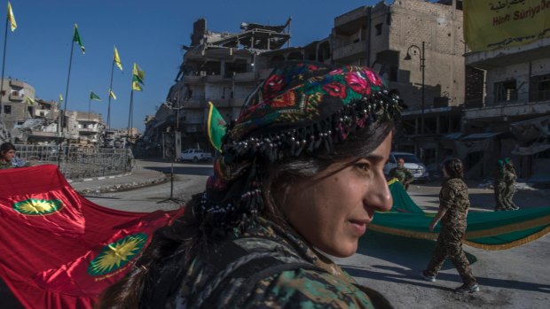 Fighters from the Women's Protection Units hold a celebration in Paradise Square in Raqqa, Syria. The Kurdish female militia took part in freeing the city from Islamic State.