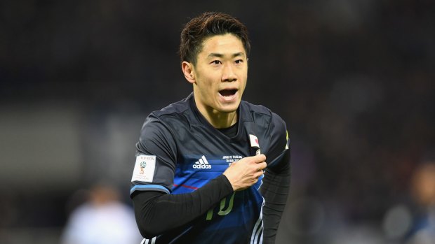 Shinji Kagawa celebrates during Japan's easy win over Thailand.